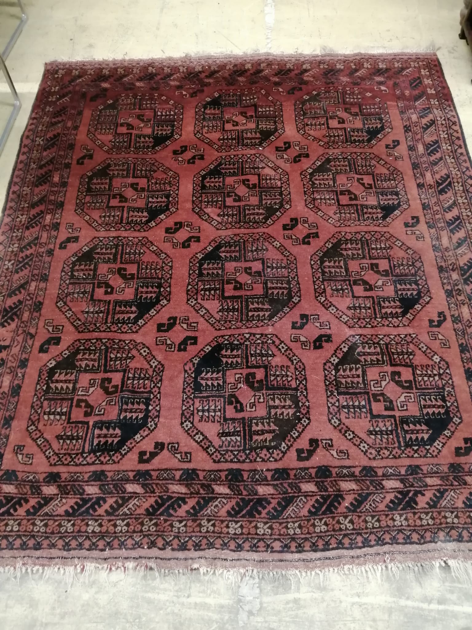 A Bokhara red ground rug, 180 x 156cm